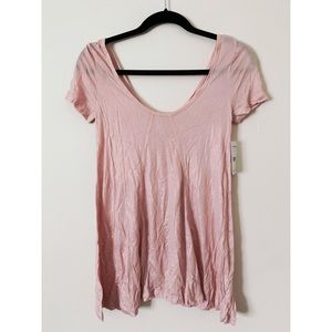 Never been worn. Light pink shimmer blouse
